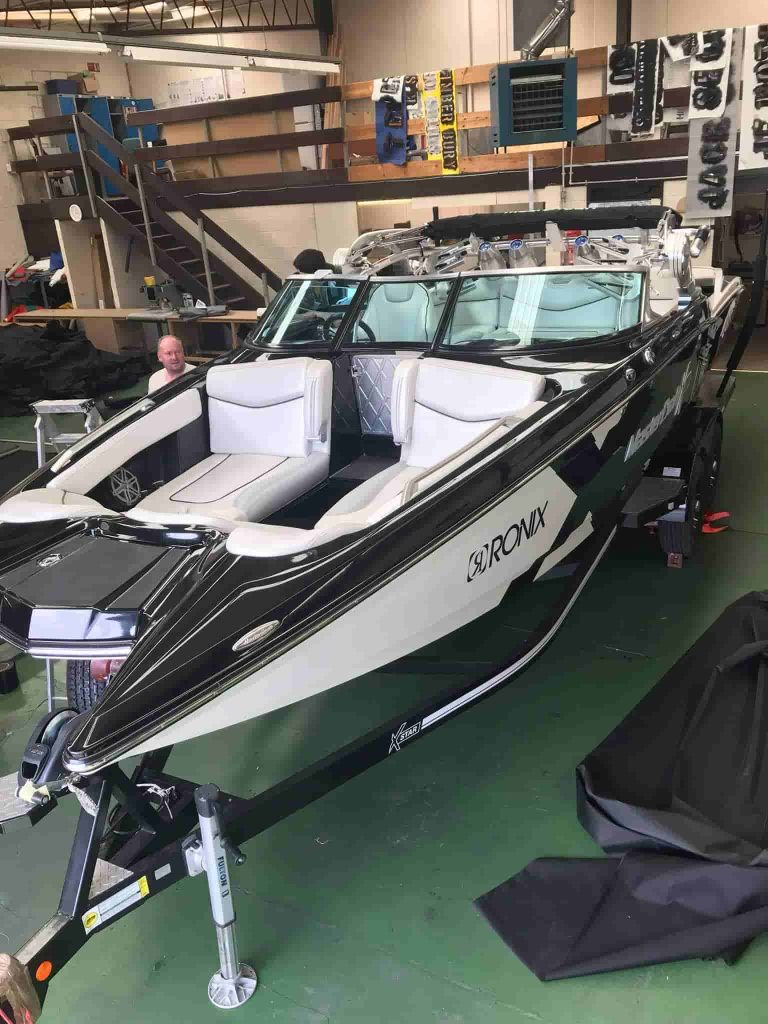 Speed boat on trailer in workshop